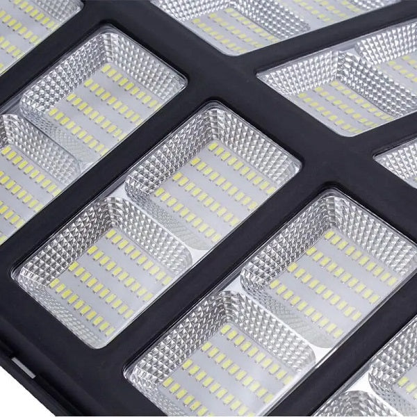 Super Electronics 1600W solar induction street light with remote control and 30W panel, featuring sensor and LED illumination.