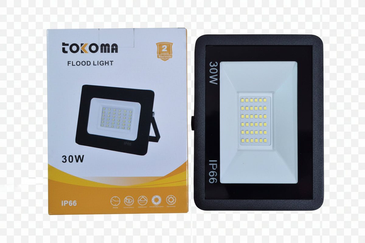 Tokoma LED flood light mounted outdoors, bright white illumination, durable metal housing, ideal for security and exterior lighting.