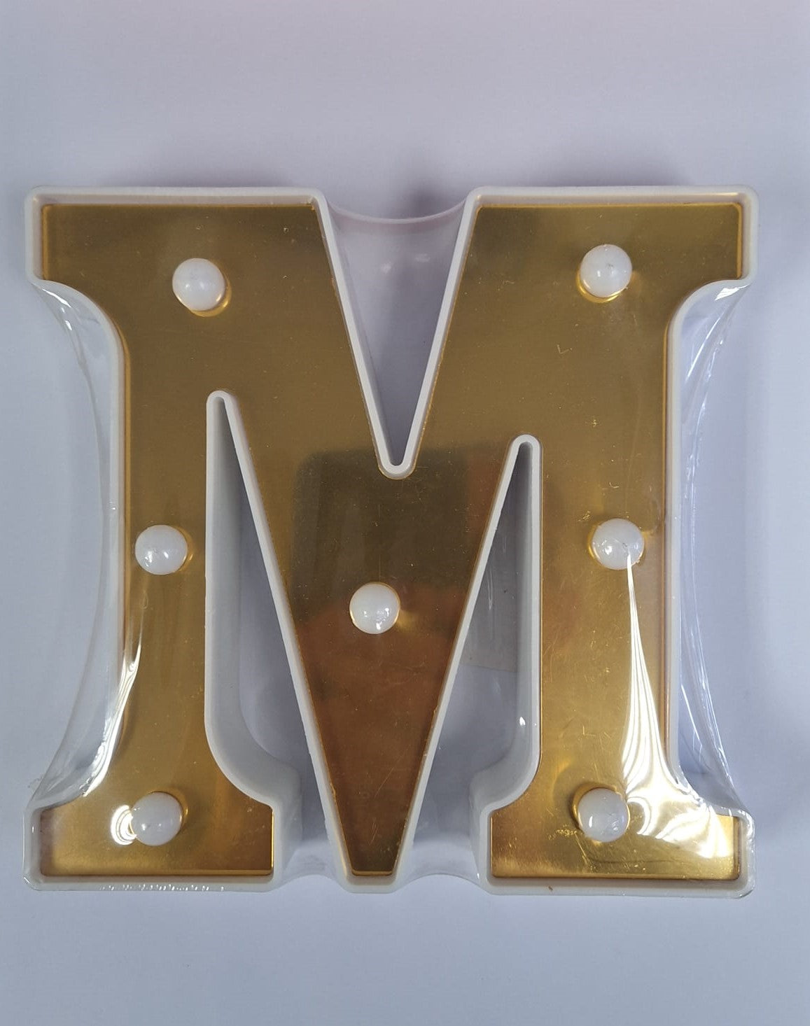Gold and white decorative illuminated letters spelling "ET" on a neutral background, perfect for stylish home decor.