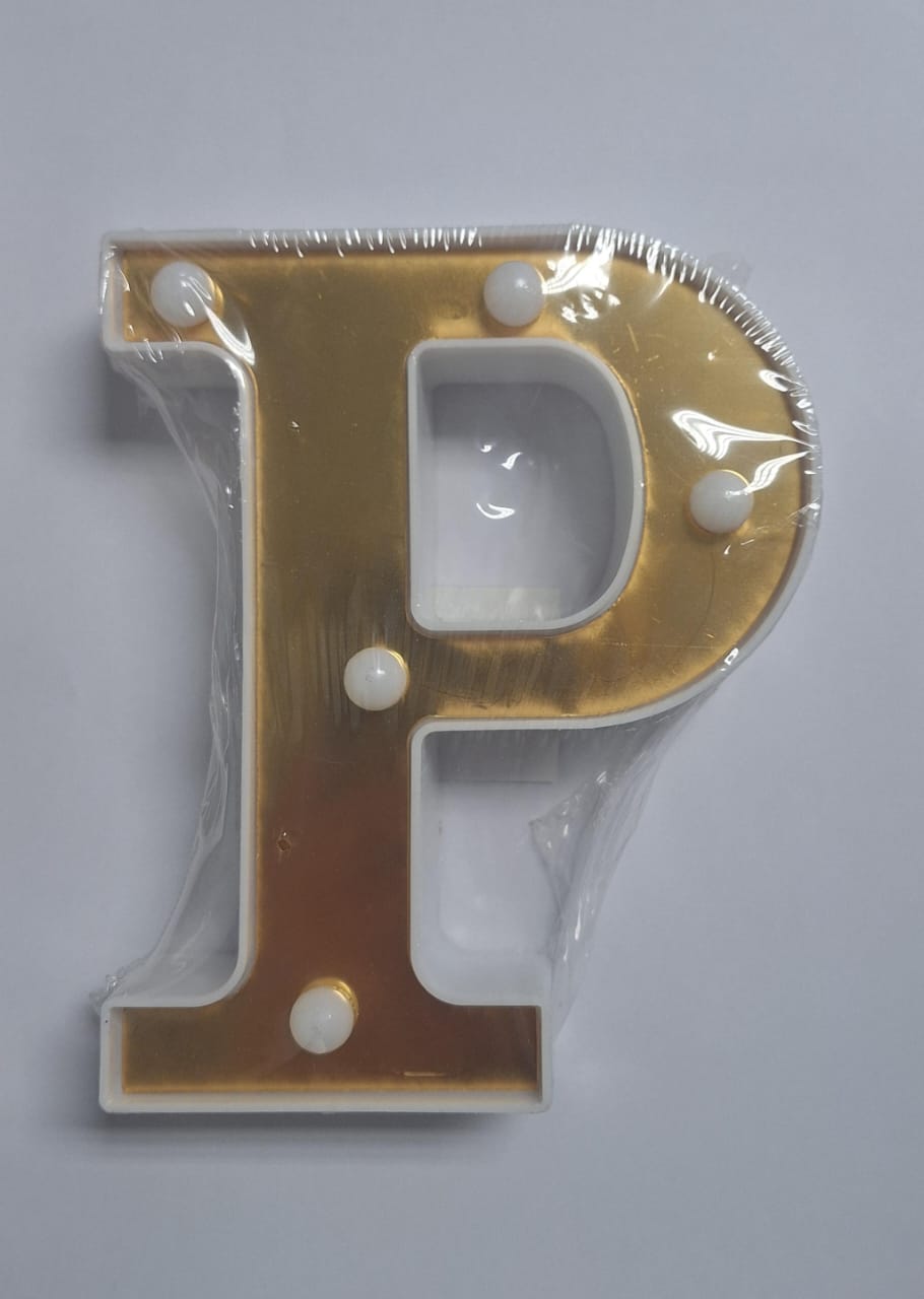 Gold and white decorative ET brand illuminated letter set spelling "LOVE" on a neutral background.