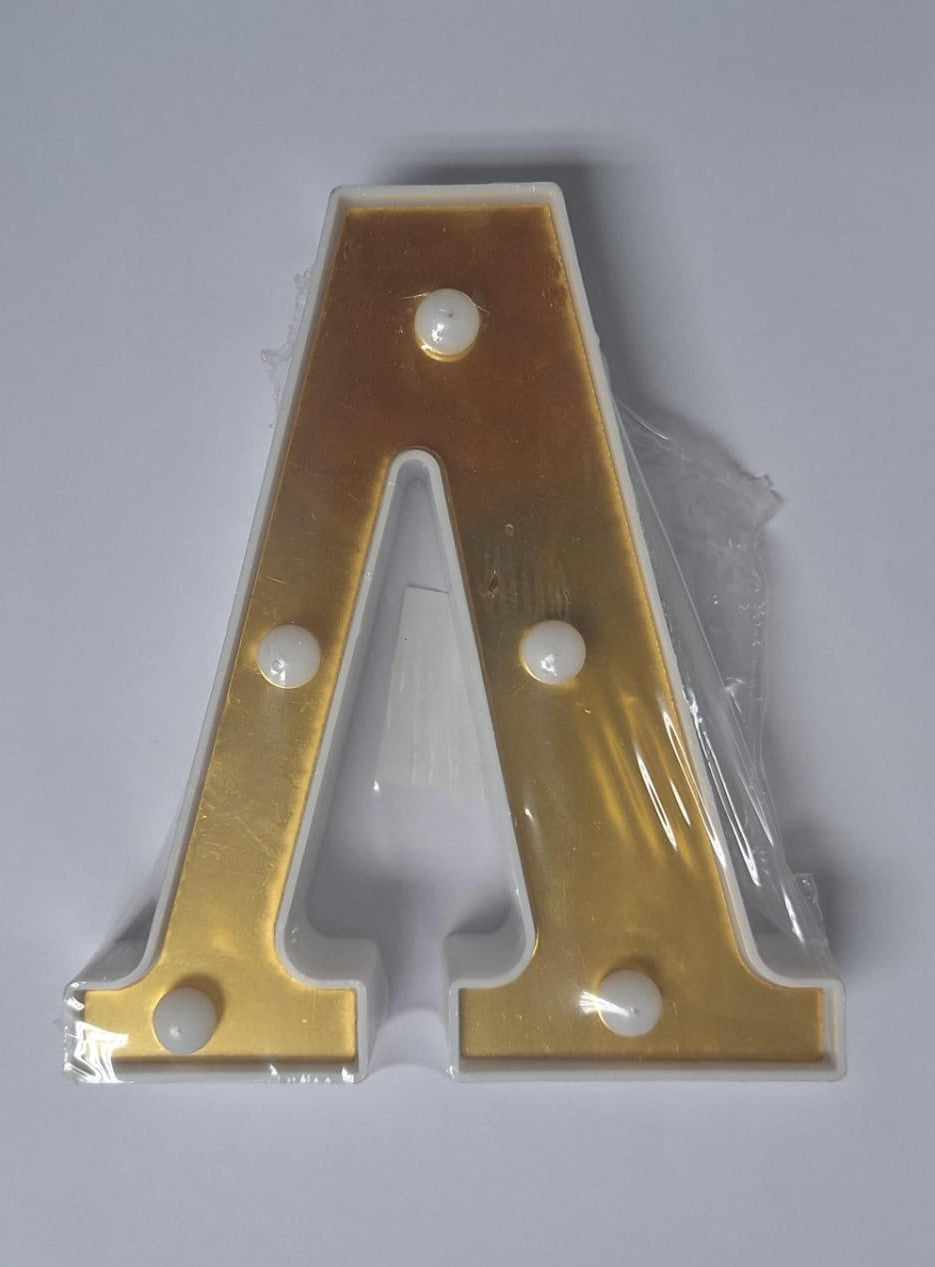 Gold and white decorative light-up letters from ET, showcasing illuminated alphabet characters for stylish home decor.