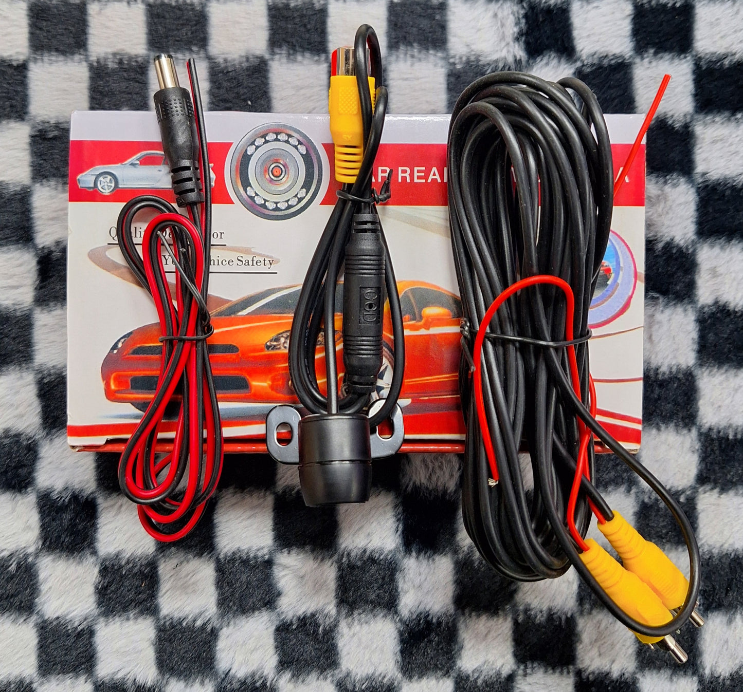 High definition 12V rearview circular camera by Little Tokyo SA, showing the compact, round design for vehicle rearview safety.