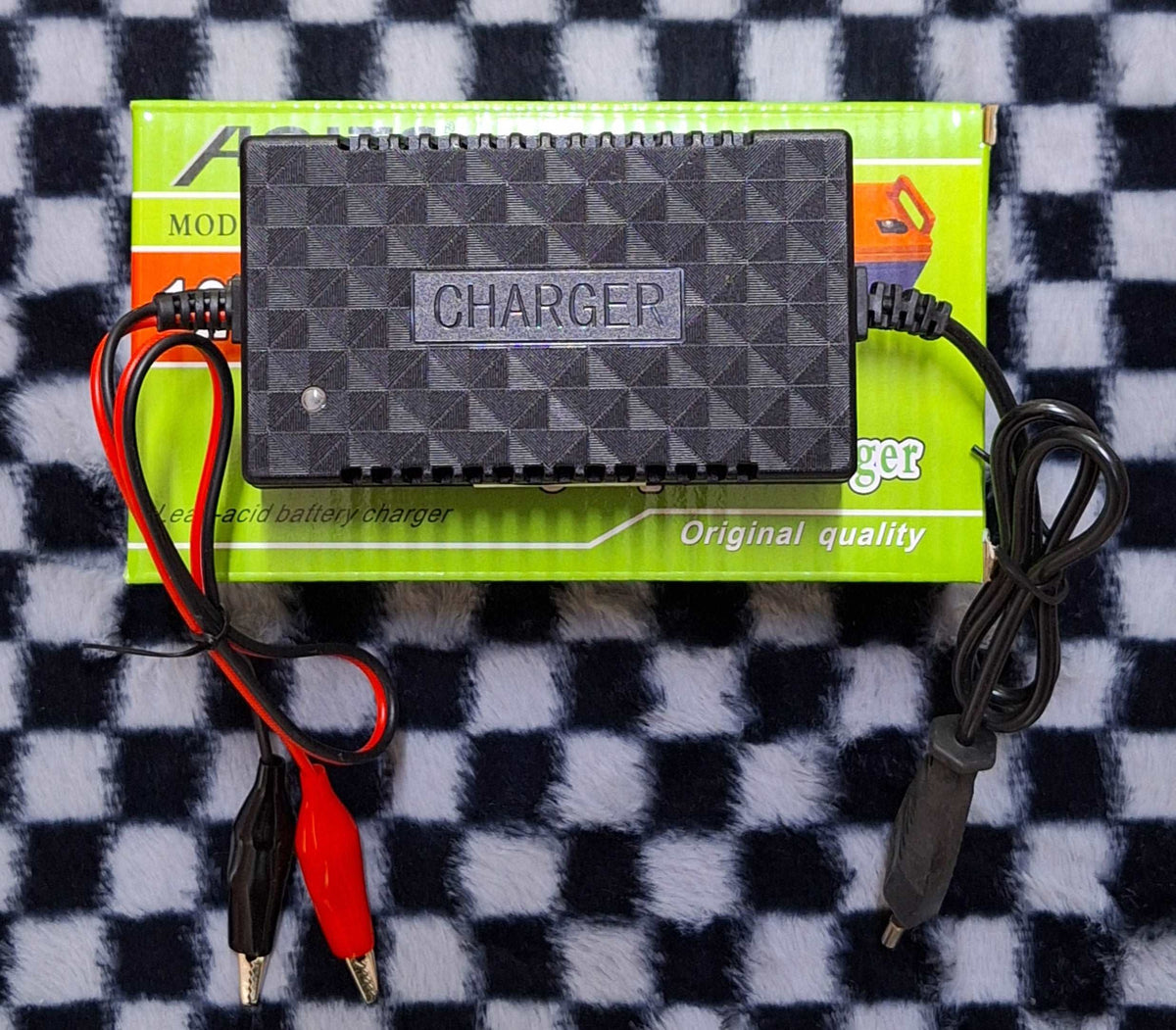 ET Aoits 12V 2A Lead-Acid Intelligent Pulse Battery Charger connected to a lead-acid battery for charging and maintenance.