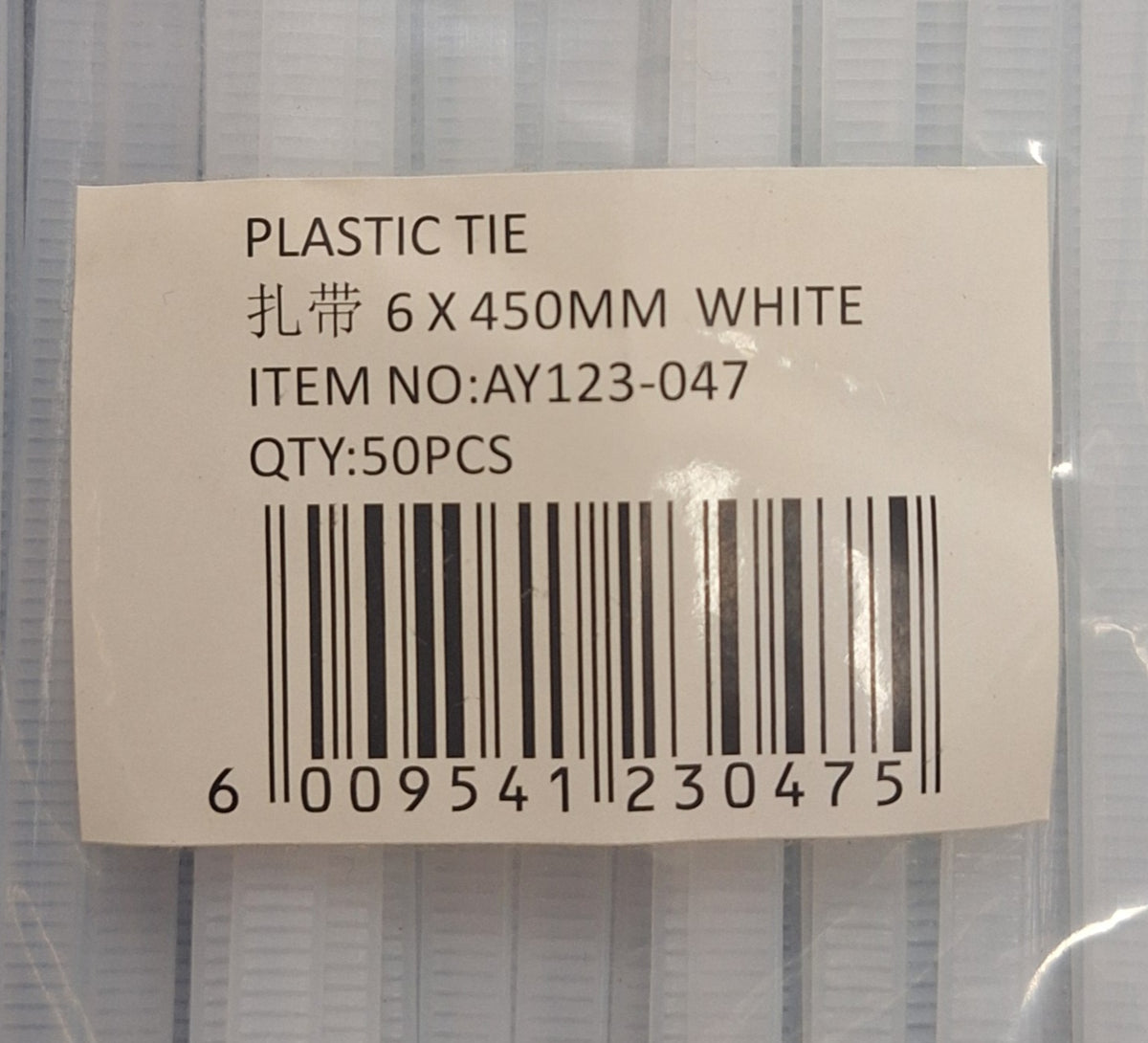 Six packs of 450mm white plastic cable ties by Little Tokyo SA, showing tightly bundled white zip ties for organizing cables.