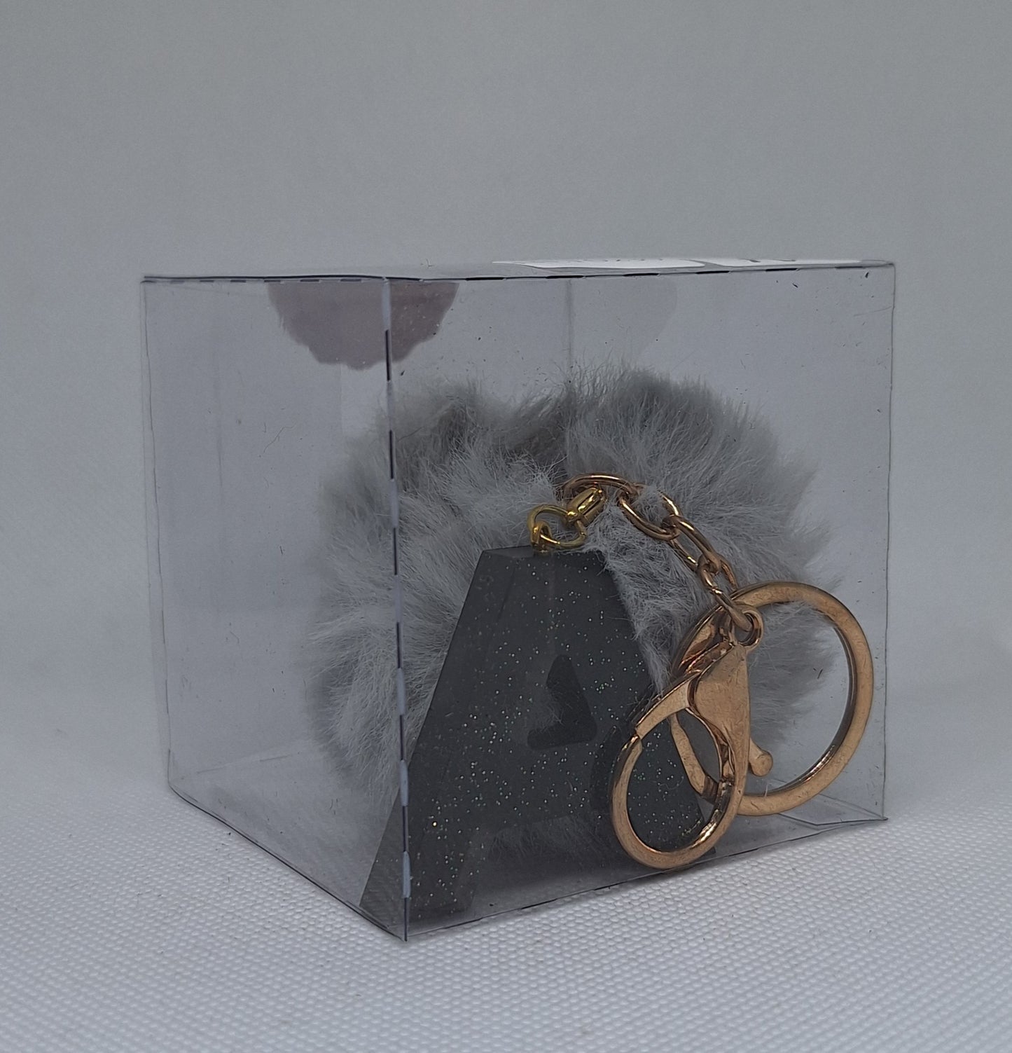 Custom Resin Letter Keychain With a Grey Pom Pom - A Custom Resin Letter Keychain With a Grey Pom Pom - A