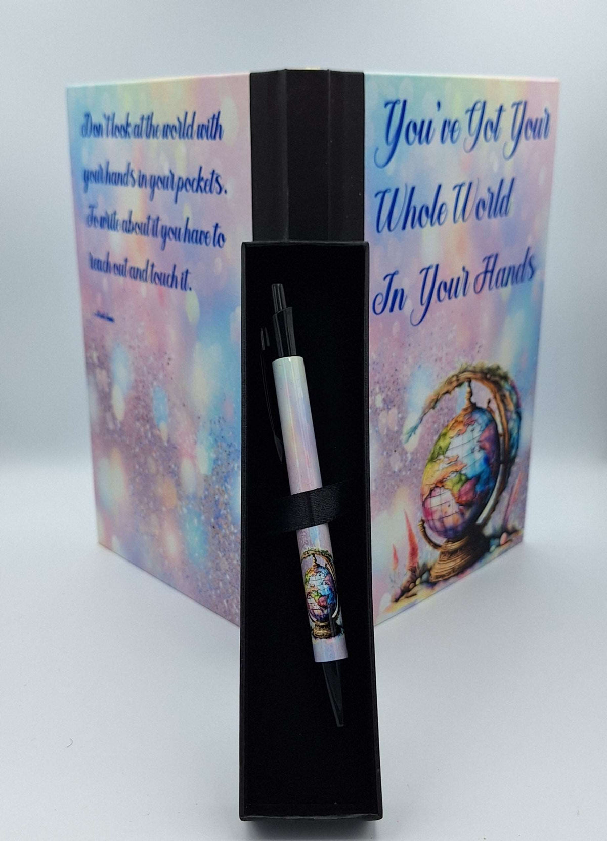 Custom printed Nifty Lil Things notebook with quote design and matching pen for writing and note-taking.