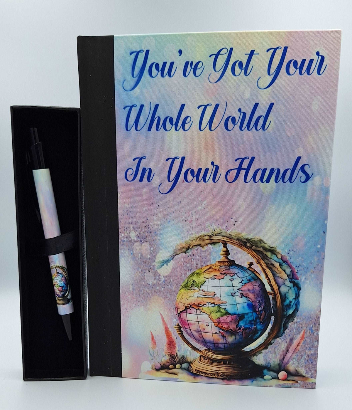 Custom printed notebook with quote and matching pen from Nifty Lil Things, featuring a stylish cover and coordinating writing accessories.