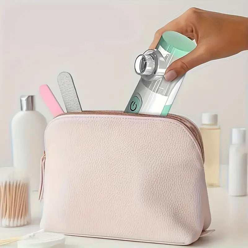 Portable Temu handheld facial steamer and nebulizer, 2-in-1 skin care device, showing the compact humidifier in use.