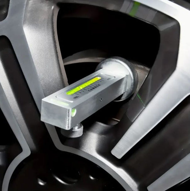 Temu magnetic wheel alignment gauge tool showing castor and camber measurement scales for vehicle wheel alignment.