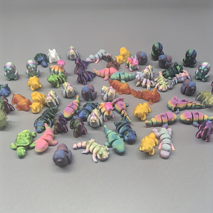 Set of 60 colorful 3D printed animal kingdom figures in various styles and colors, featuring detailed animal designs.