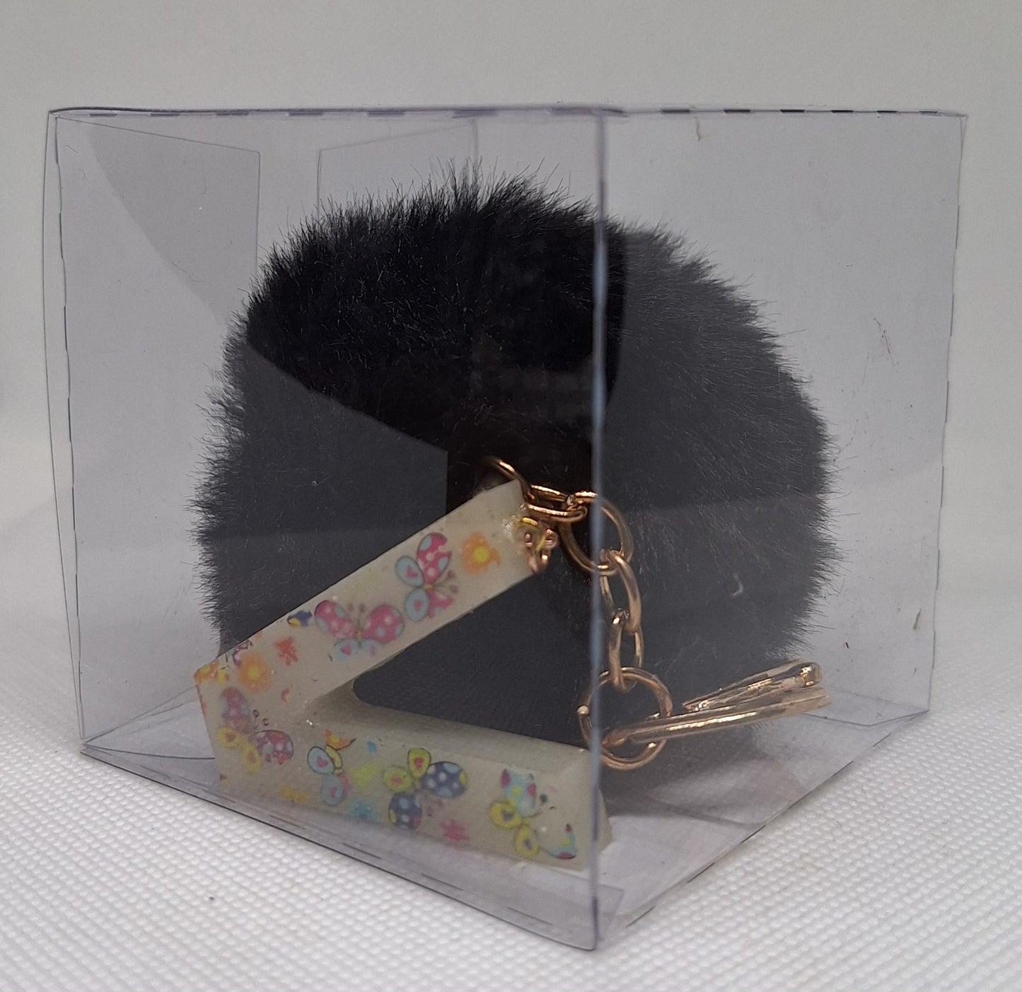 Custom Resin Letter Keychain With a Black Pom Pom - V