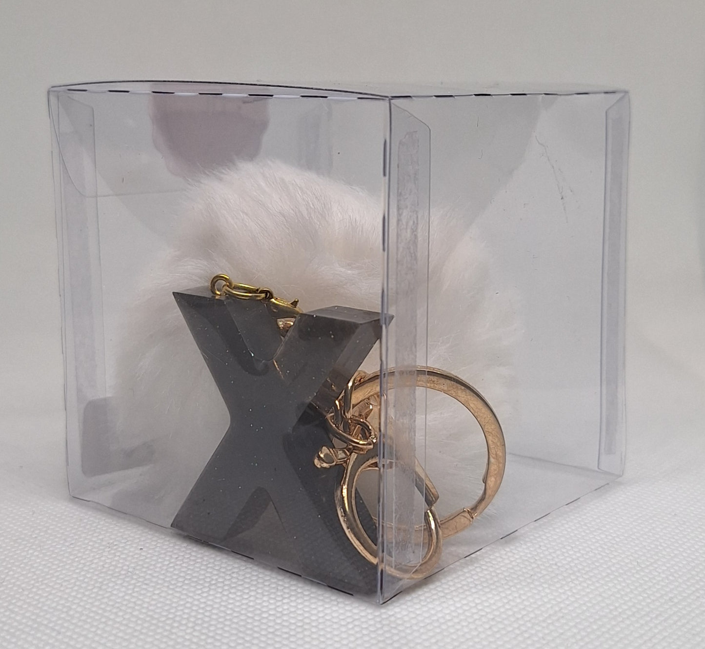 Custom Resin Letter Keychain With a White Pom Pom - X