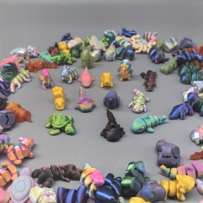 Assorted 3D printed animal kingdom figures in various styles and colors, perfect for collection or educational display.